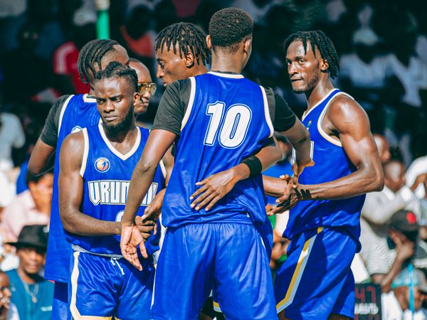 A basketball team celebrating after a live-scored game.